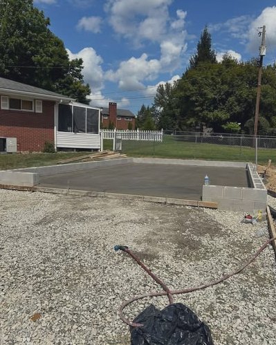 Concrete block foundation walls set on a gravel base beside a house in Huntersville, NC